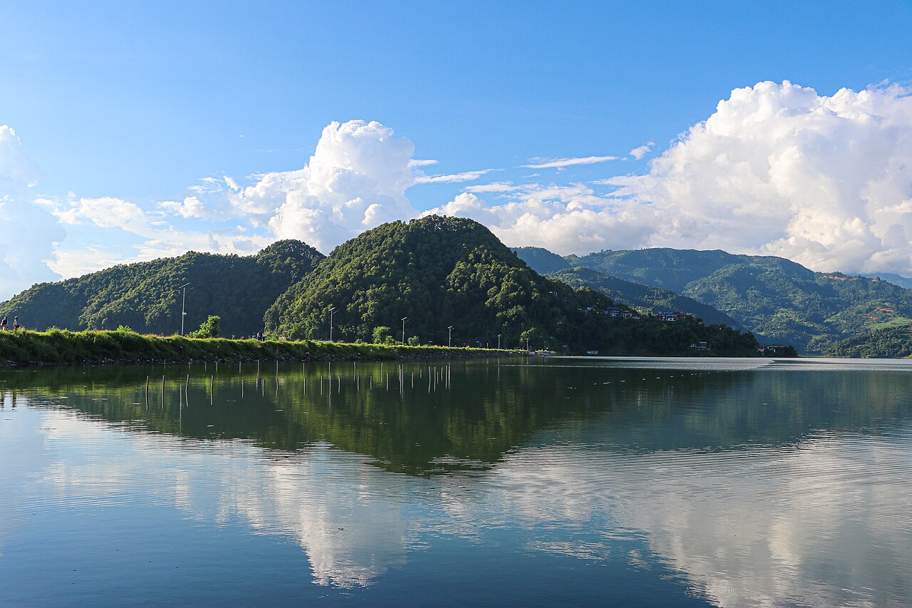 Begnas Lake reflecting surrounding green hills